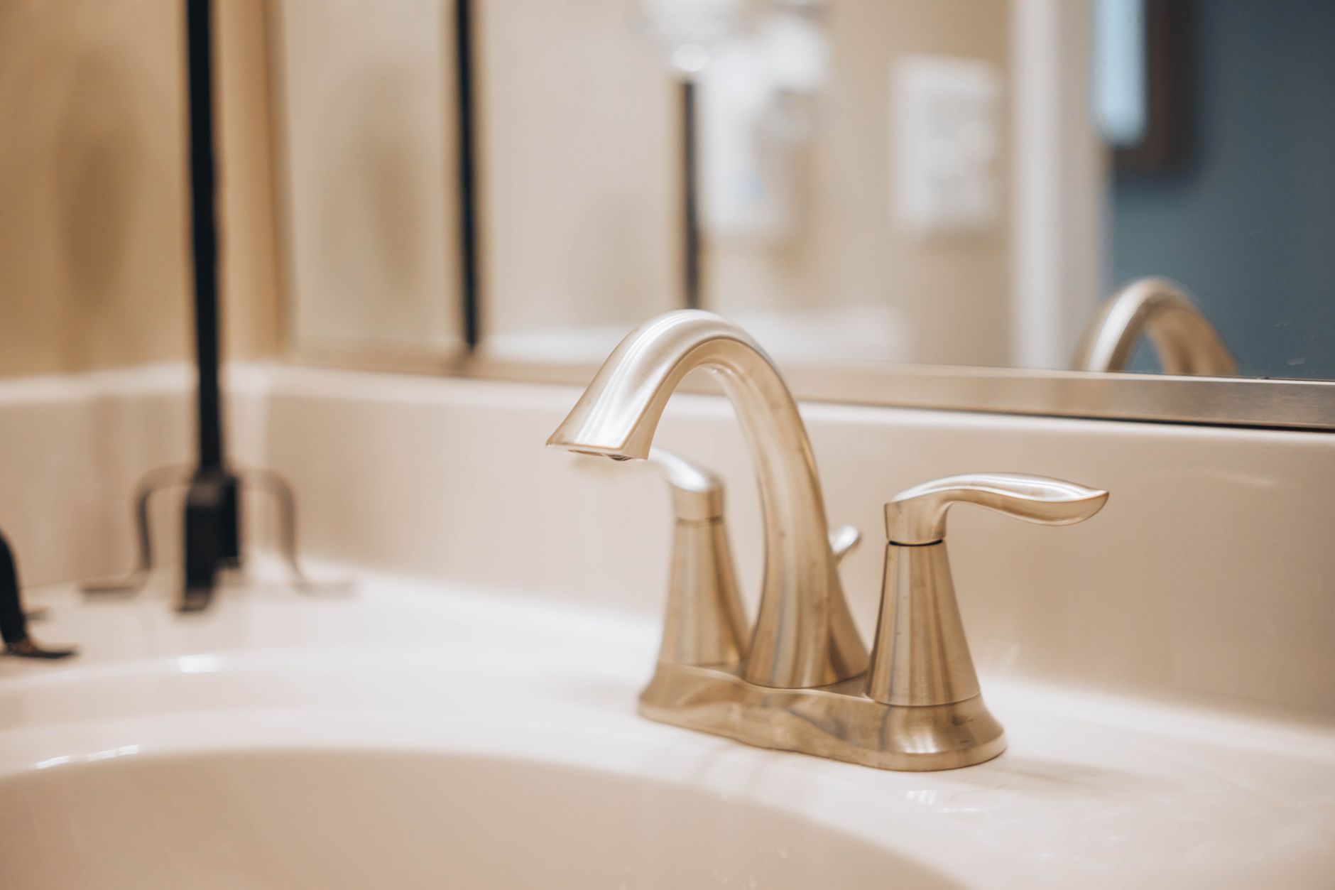 Hard water scale deposits on a bathroom faucet — Springfield, IL water at 10.8 GPG (185 ppm)