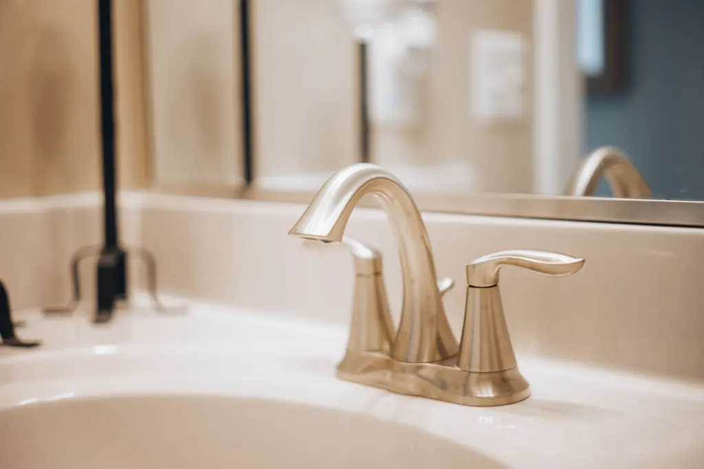 Hard water scale deposits on a bathroom faucet — Vancouver, BC water at 1.31 GPG (22.4 ppm)