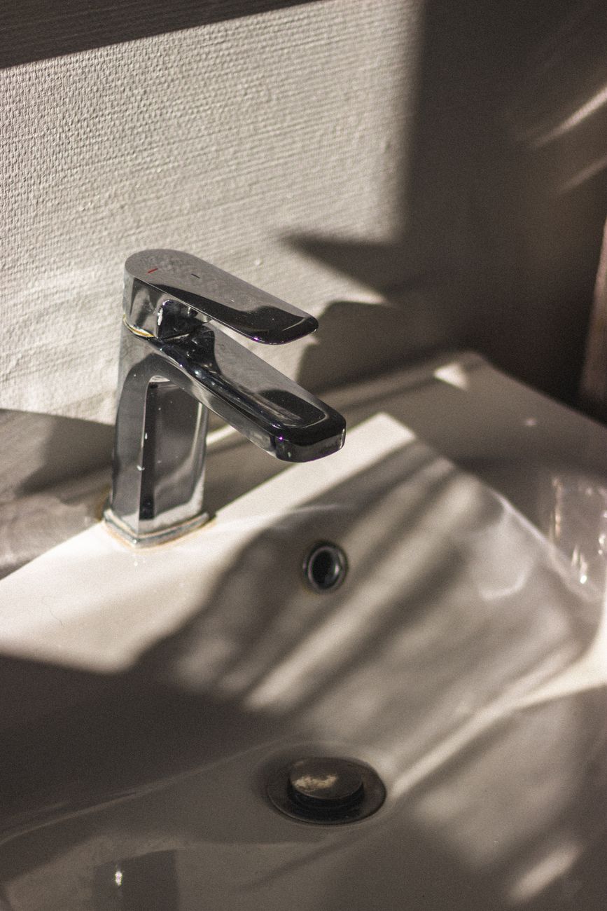 Chrome faucet on a ceramic sink — recommended for Augusta hard water treatment