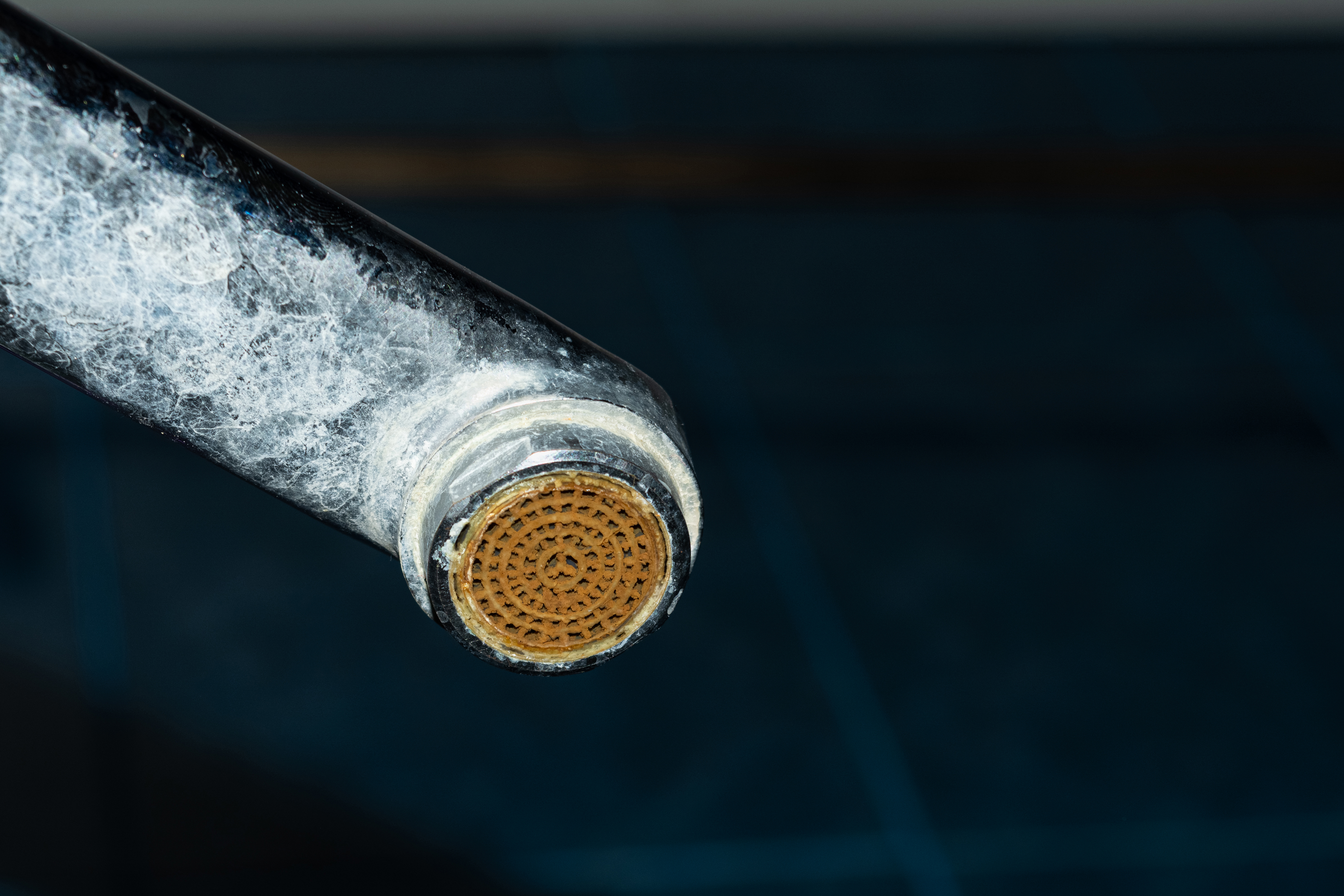 Heavy limescale and mineral buildup on a Amarillo faucet — 16 gpg very hard water