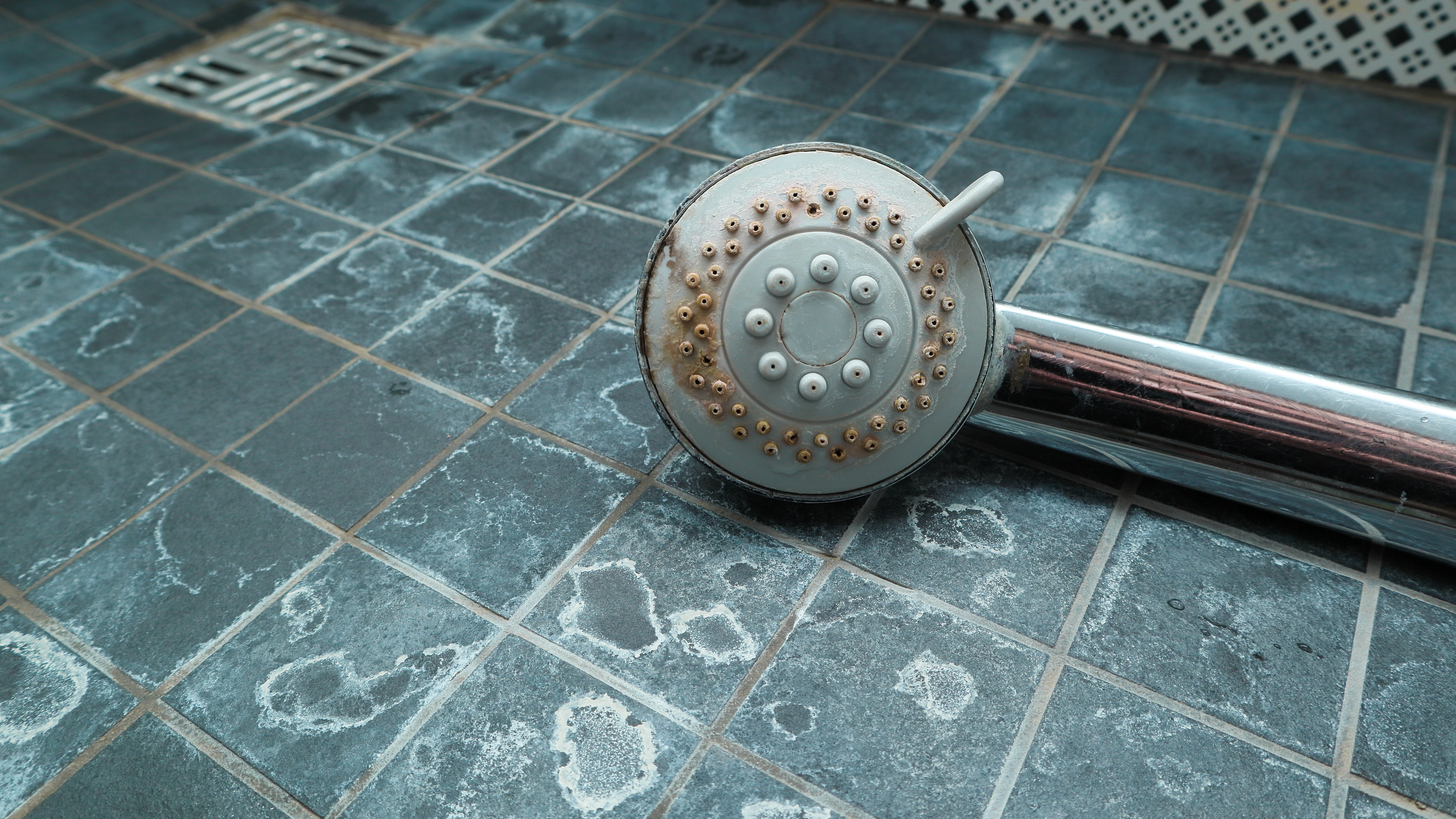 Heavy limescale and mineral buildup on a Fresno faucet — 8–13 gpg hard water