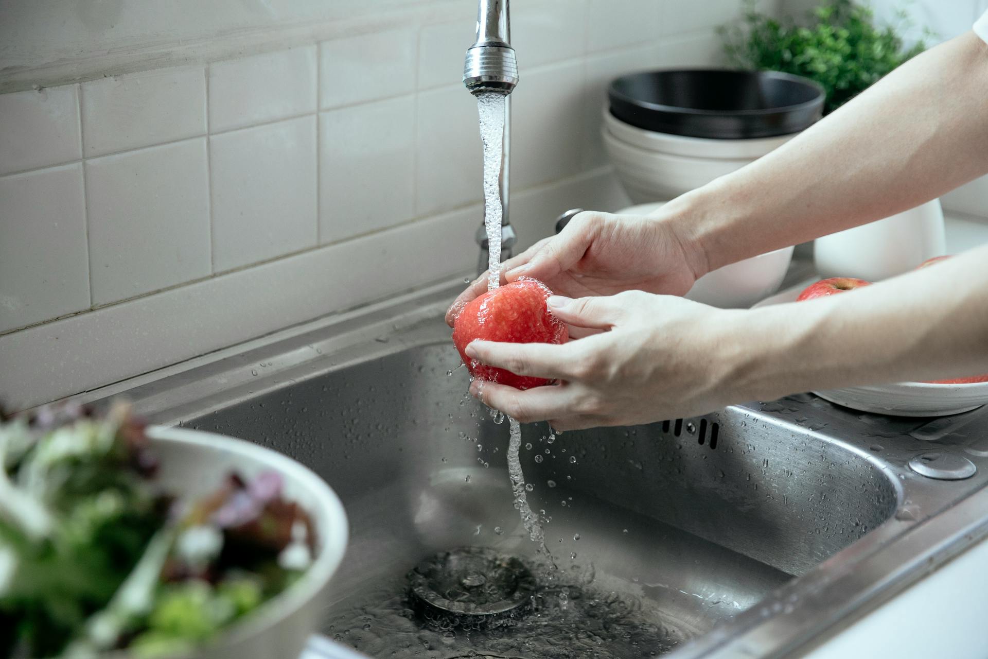 Household tap water being tested for hardness and mineral content — Cape Coral, FL water at 18.6 GPG (318 ppm)